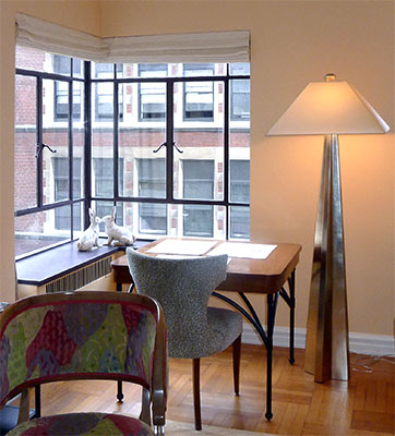 Streamline Moderne corner windows create a sunny spot for a work table
