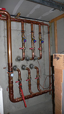Coolant tubing header in Basement Mechanical Room
