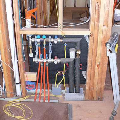 Radiant heating manifold used to adjust system zone